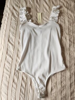 White Ruffled Strap Womans Body Suit.